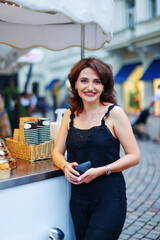 girl buys ice cream on the street of Karlovy Vary