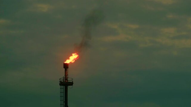 Methane gas flare flame combustion natural oil production industry night time