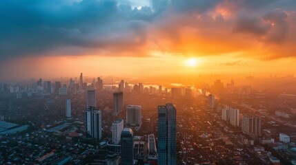 Fototapeta premium Aerial view of cityscape at sunset with glowing sky for urban development and cityscape marketing 