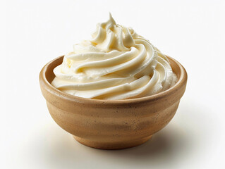 Creamy whipped frosting in a clay bowl on a plain background