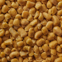 a close up of a pile of nuts with a lot of brown stuff