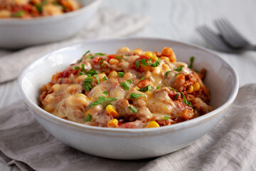 Homemade One-Pot Cheesy Taco Pasta in Bowls, low angle view. Close-up.