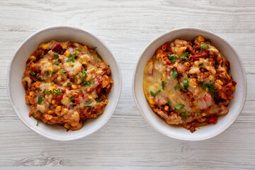 Homemade One-Pot Cheesy Taco Pasta in Bowls, top view. Overhead, flat lay, from above.