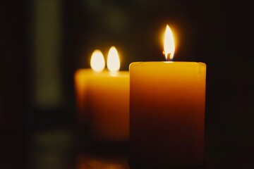 A couple of candles sitting on top of a table