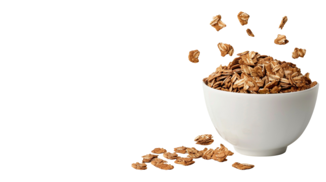 A white bowl filled with crunchy granola spilling over isolated on a white background, perfect for breakfast or snack imagery.