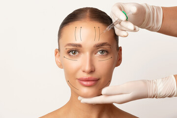 Beautiful lady face with arrows, botulinum toxin injections in woman's forehead for blocking mimic...