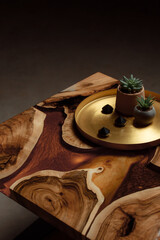 Expensive vintage furniture. The table is covered with epoxy resin and varnished. A gold epoxy...