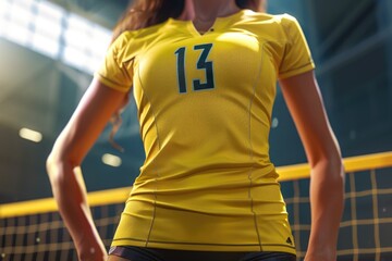 Fototapeta premium A woman holds a volleyball, ready to play or exercise