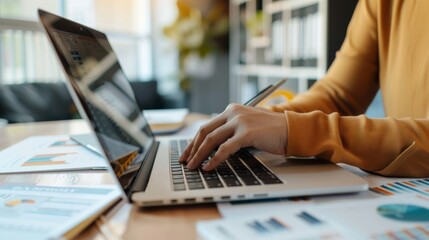 Businesswoman working on laptop computer in office