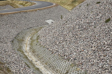 A ditch draining water by the road
