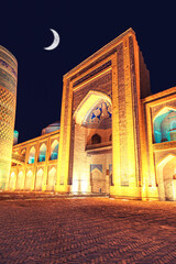 Kalta Minar and Muhammad Amin Khan Madrasah illuminated at night.