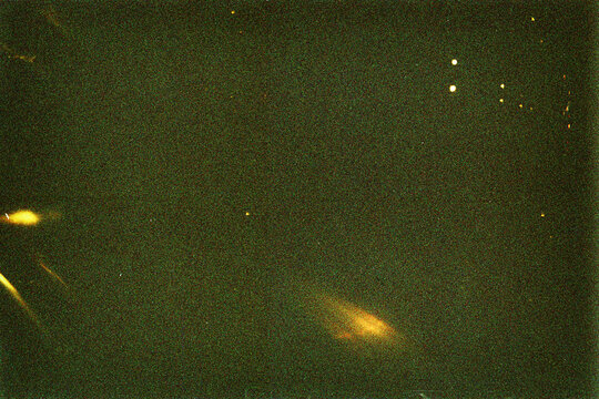 Blank grained film strip texture background with heavy grain, dust and light leak