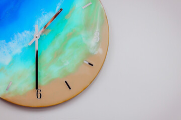 Round wall clock with ocean shore pattern. Vacation time concept. Time for rest and lunch....