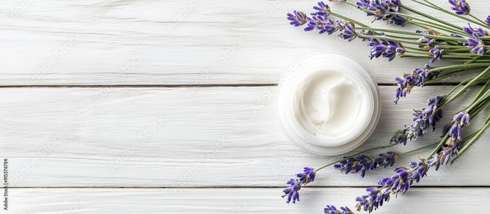 Poster cosmetic cream and lavender on a white wooden table background. with copy space image. place for add