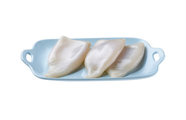 Raw squid tubes in a blue plate isolated on a white background.