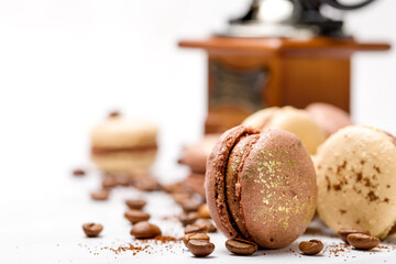 Macaroons with chocolate cream on a light background.