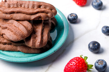 Chocolate shortbread cookies. Light background.
