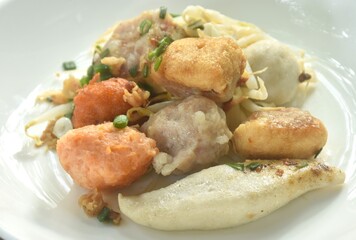 dry steamed Hakka meatball made from chop pork stuffing fried tofu with bean sprout on plate dipping chili sauce and soup