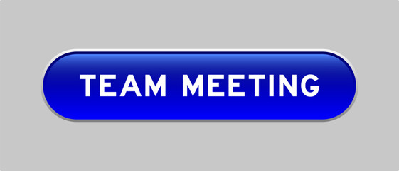 Fototapeta premium Blue color capsule shape button with word team meeting on gray background