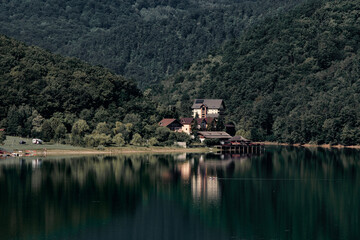 Forest reflection on a clear lake in Hunedoara, Romania