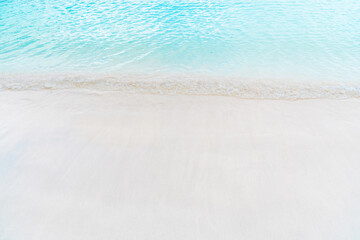 Pristine white sandy beach with crystal clear turquoise water and a sandy shore. Abstract tropical nature backgrounds