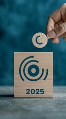 2025 Wooden Block with Target Icon: New Year Business Strategy Concept