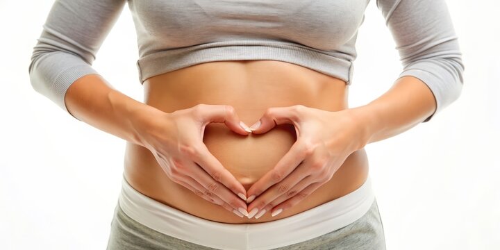 A serene woman's hands cradle her stomach and heart, conveying hope and self-care for wellness, diet, detox, nutrition, and fertility on a clean white background.