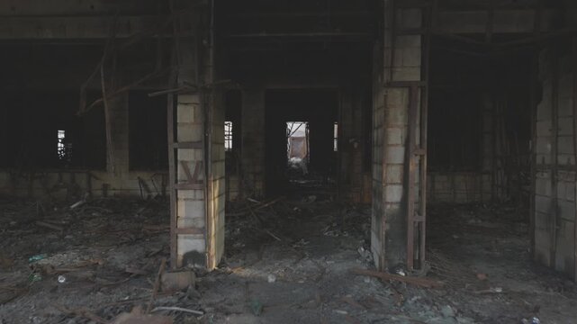 War in residential areas, shop smashed and burned. War in the city. City in war zone. Damage to a shop as a result of artillery shelling. Armed conflict in Ukraine. ProRes 422, ungraded C-LOG 10 bit.