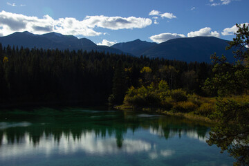 A beautiful landscape of a lake in the green forest in the Valley of the Five Lakes