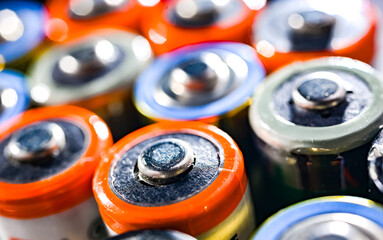 Different alkaline batteries. Chemical waste