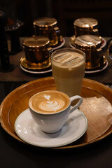Coffee drinks on wooden tray