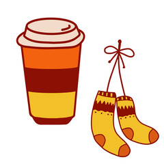 Warm coffee cup beside cozy yellow and orange striped socks during autumn season