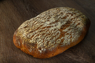 Homemade rye bread. rye bread on a wooden background in a rustic style. Top view.