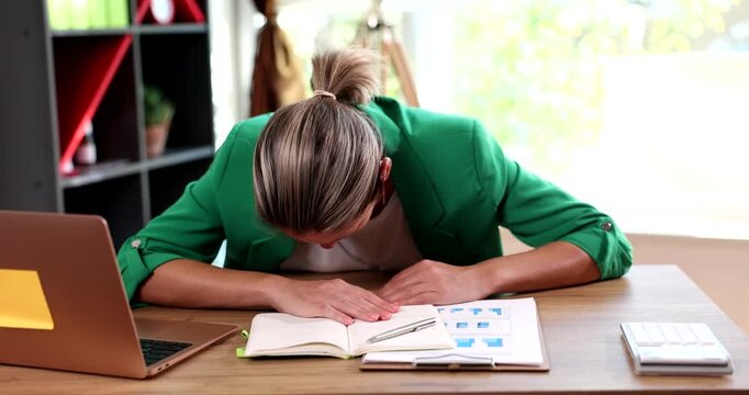 Sleepy business woman falling on table while working in office 4k movie slow motion. Constant drowsiness and apathy concept