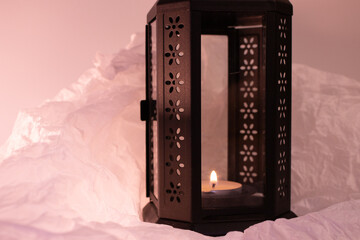 This black metal lantern with a glass panel creates a spooky, flickering glow when lit with the...