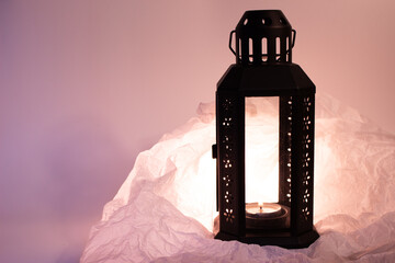 This black metal lantern with a glass panel creates a spooky, flickering glow when lit with the...