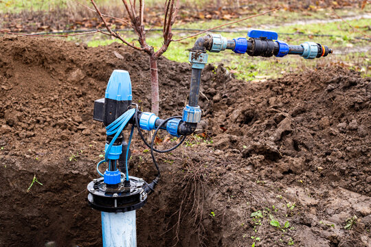 water intake unit in a well dug in the ground. Installation of a water distribution system