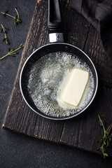 Melted butter on in iron pan