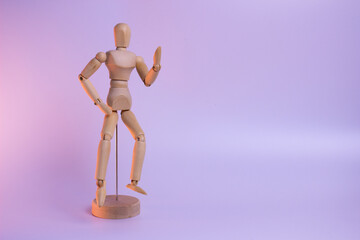 A minimalist wooden figure with a simple, abstract human form. The smooth, polished wood has a warm, natural tone and texture. A calming, meditative presence.