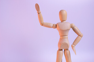 A minimalist wooden figure with a simple, abstract human form. The smooth, polished wood has a warm, natural tone and texture. A calming, meditative presence.