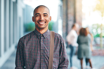 Happy man, portrait and campus with bag at university for education, learning or outdoor break. Young male person or student with smile for academic journey, development or scholarship at college