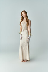 A lovely woman in a fitted dress adorned with floral accents stands gracefully.