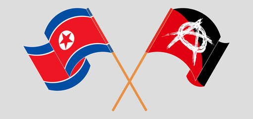 Crossed and waving flags of North Korea and Anarchy