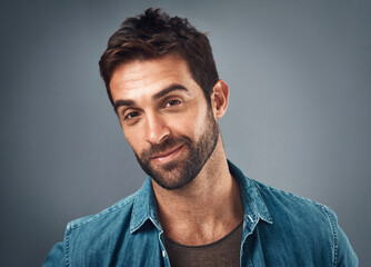 Happy, smile and portrait of man in studio with positive attitude, confidence and pride. Relax,...