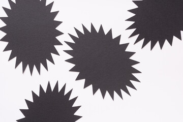 black and white background featuring polygonal stars also known as 'starbursts"