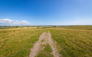 Trail through southern swedish Skolbacken grassland landscape near Trelleborg