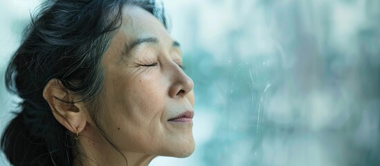 Asian woman in deep thought and concentration. with copy space image. Place for adding text or design