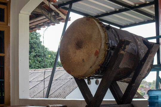 Traditional wooden bedug drum hanging in the veranda of a mosque