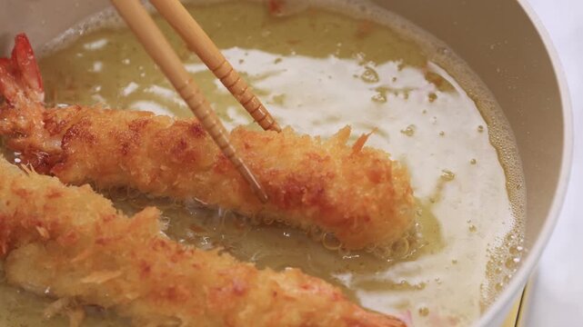 Cooking Scene Frying Japanese Tempura Shrimp using Chopstick