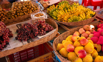 Tropical fruits and vegetables on local street market in Cambodia